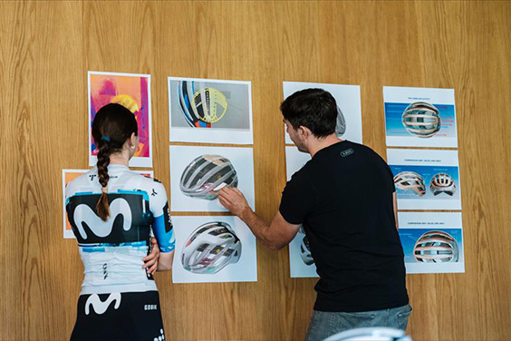 Liane Lippert and a product manager from ABUS scrutinise sketches of the new AirBreaker 2.0 racing bike helmet &copy; ABUS