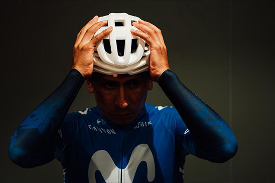 Rider of the Movistar Team puts on a test model of the AirBreaker 2.0 racing bike helmet &copy; ABUS