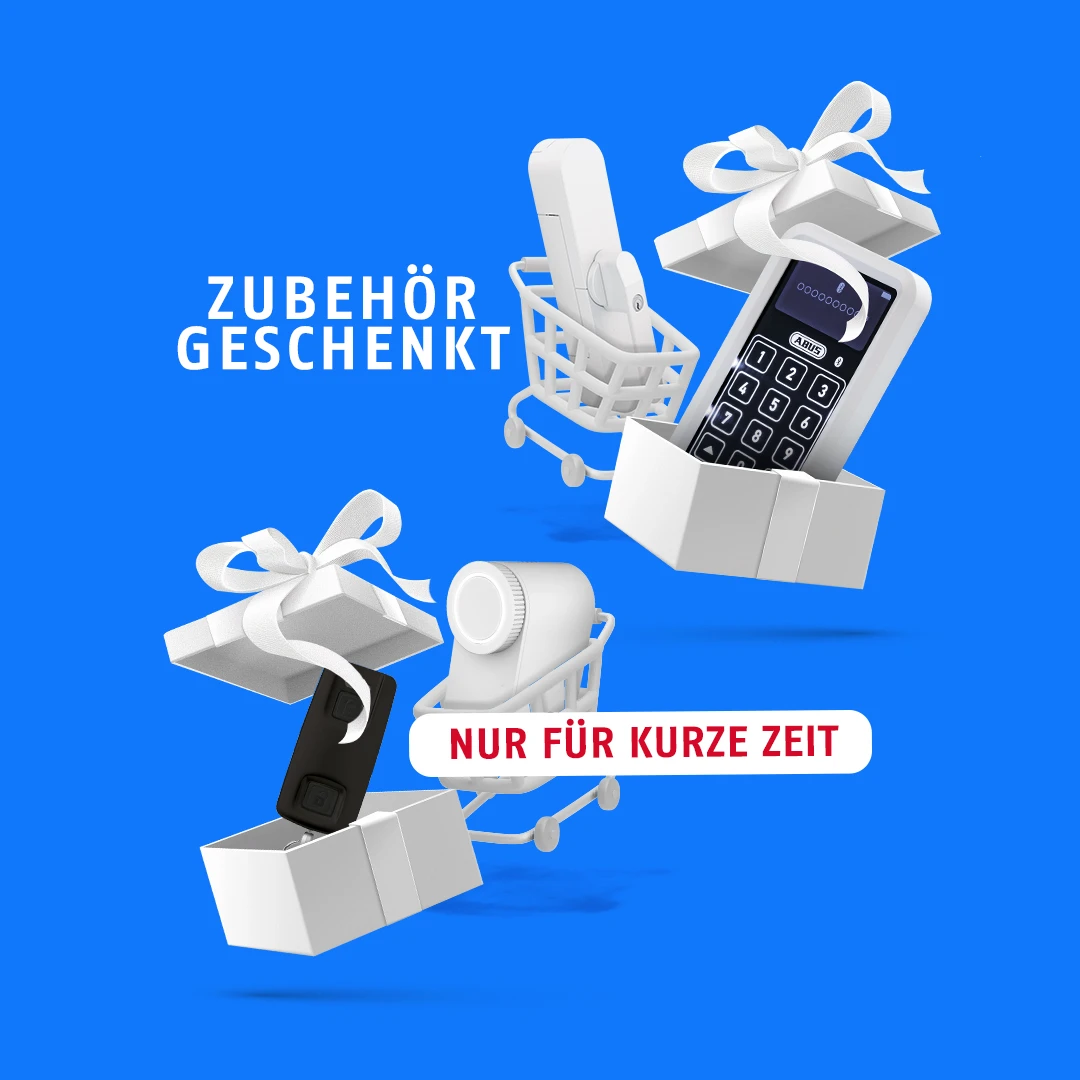 WINTECTO und LOXERIS in einem Einkaufswagen und davor geöffnete Geschenkboxen, mit einer Tastatur und einer Fernbedienung drin. Schrift auf Bild: Zubehör geschenkt & nur für kurze Zeit © ABUS