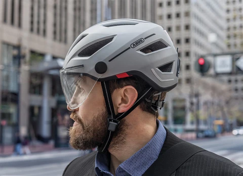 Close-up of man in side view wearing urban bicycle helmet Pedelec 2.0 ACE © ABUS