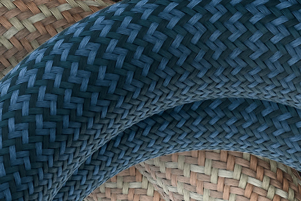 Close-up van de geweven textielhoes van het YARNIT-kettingslot © ABUS