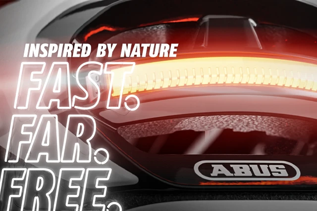 Taipan Fahrradhelm mit integriertem LED-Rücklicht und Slogan ‚Inspired by nature. Fast. Far. Free." © ABUS